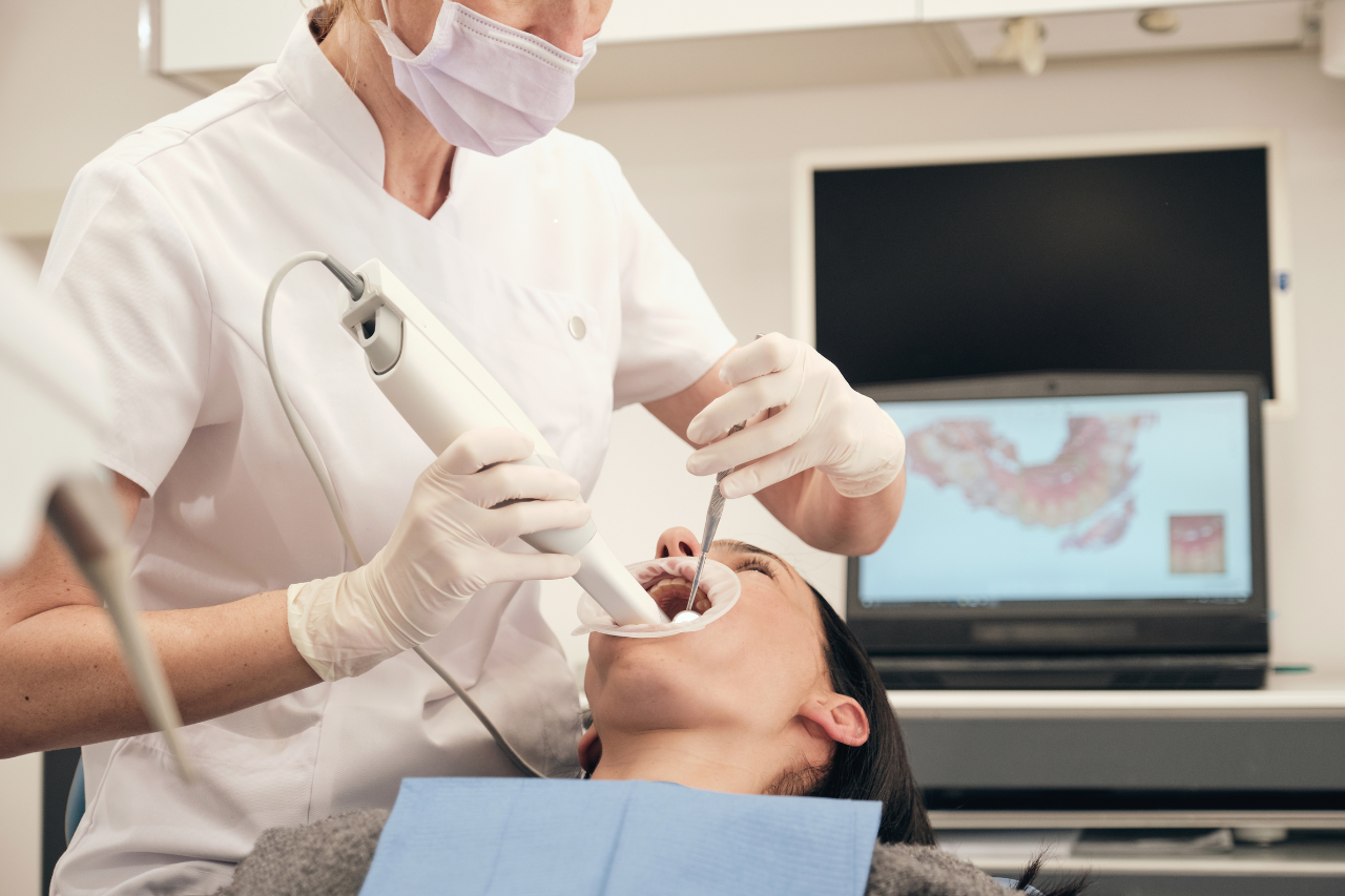 Dentist examining a dental X-ray for accurate diagnosis and treatment planning.